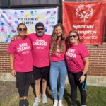 4 RCS Learning Center staff members standing outside in matching shirts